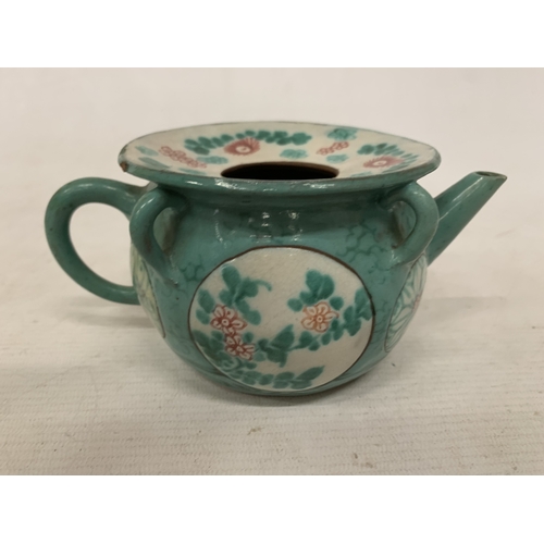 44 - A CHINESE ENAMELLED YIXING TEAPOT WITH A GREEN GLAZED BODY AND ENAMELLED FLORAL DECORATION