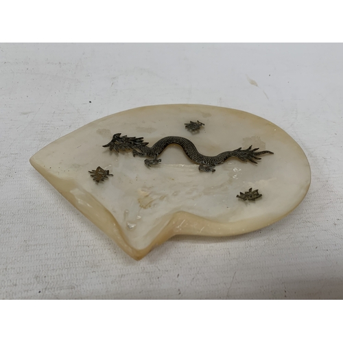 50 - A CHINESE EXPORT SILVER DRAGON RELIEF DISH, MOUNTED ON A MOTHER OF PEARL SHELL, 18CM X 14CM