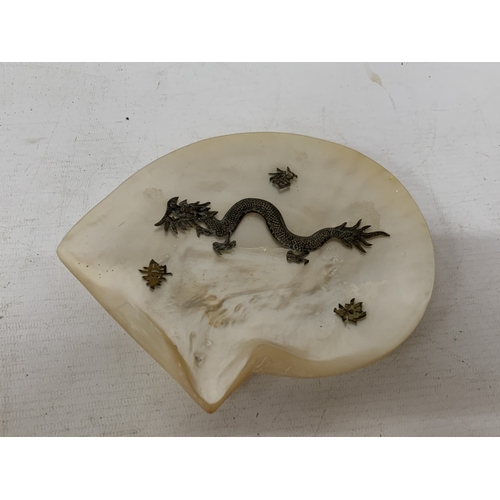 50 - A CHINESE EXPORT SILVER DRAGON RELIEF DISH, MOUNTED ON A MOTHER OF PEARL SHELL, 18CM X 14CM