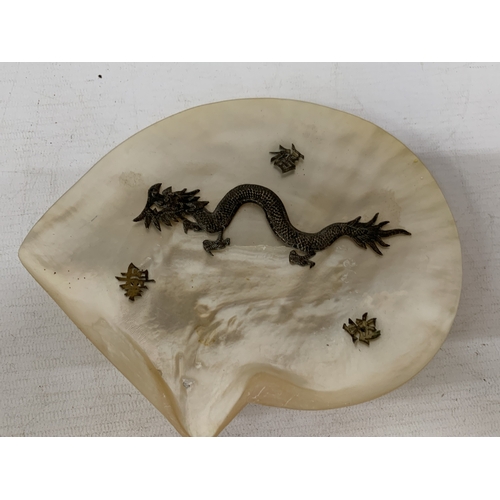 50 - A CHINESE EXPORT SILVER DRAGON RELIEF DISH, MOUNTED ON A MOTHER OF PEARL SHELL, 18CM X 14CM