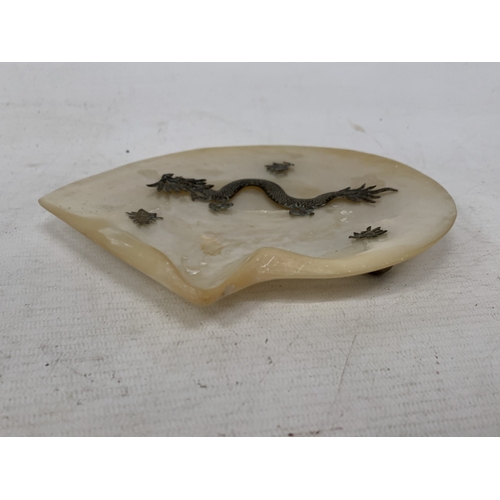 50 - A CHINESE EXPORT SILVER DRAGON RELIEF DISH, MOUNTED ON A MOTHER OF PEARL SHELL, 18CM X 14CM