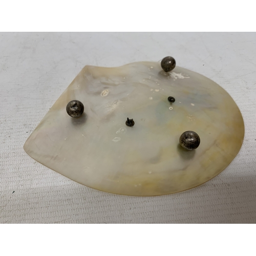 50 - A CHINESE EXPORT SILVER DRAGON RELIEF DISH, MOUNTED ON A MOTHER OF PEARL SHELL, 18CM X 14CM