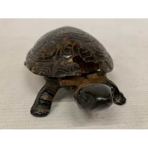54 - A VINTAGE NOVELTY TABLE BELL IN THE SHAPE OF A TORTOISE WITH A CAST BRONZE BASE - A/F