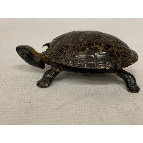 54 - A VINTAGE NOVELTY TABLE BELL IN THE SHAPE OF A TORTOISE WITH A CAST BRONZE BASE - A/F