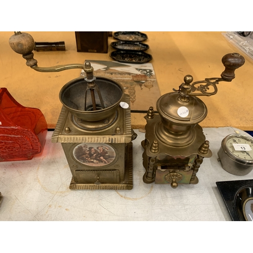16 - TWO VINTAGE BRASS COFFEE GRINDERS, ONE WITH A CERAMIC PLAQUE TO THE FRONT