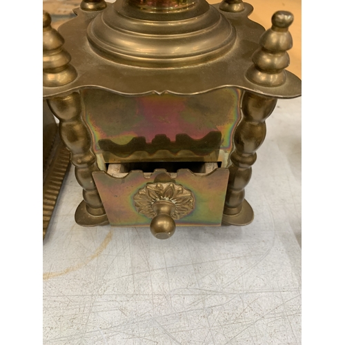 16 - TWO VINTAGE BRASS COFFEE GRINDERS, ONE WITH A CERAMIC PLAQUE TO THE FRONT