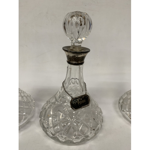 2 - THREE VINTAGE CUT GLASS DECANTERS WITH HALLMARKED SILVER LABELS AND HALLMARKED SILVER RIMS TO TWO OF... 