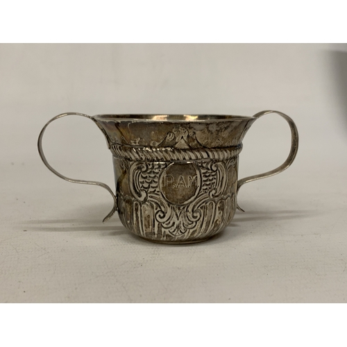 30A - A SILVER TWIN HANDLED CUP WITH REPOUSSE DECORATION - WEIGHT 59.34 G
