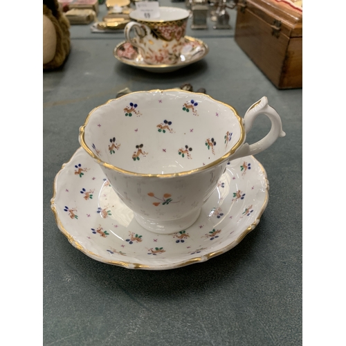71 - A GEORGIAN HILDITCH PORCELAIN CUP AND SAUCER WITH HAND PAINTED DESIGN