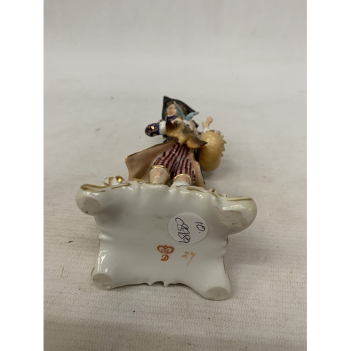 82 - A VINTAGE CROWN DERBY FIGURE OF A BOY WITH A BASKET AND A GAME BIRD, HEIGHT 18CM