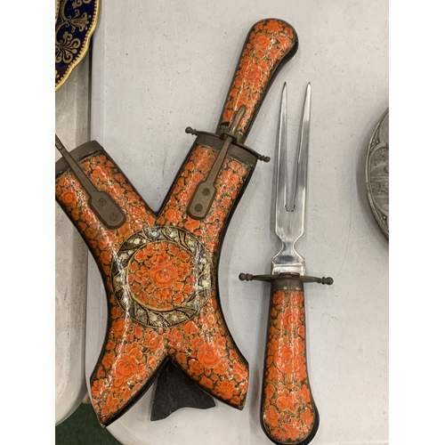 117 - AN ENAMELLED AND MOTHER OF PEARL DECORATED KNIFE SET