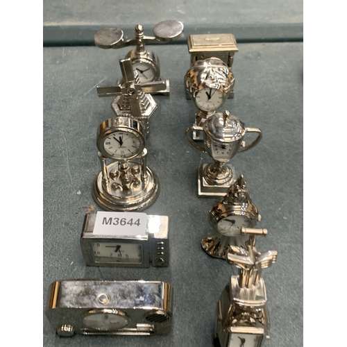 166 - A LARGE COLLECTION OF SILVER COLOURED MINIATURE CLOCKS