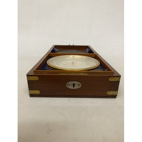 16 - AN ANEROID DESK BAROMETER MANUFACTURED BY STANLEY OF LONDON WITH A CIRCULAR GLAZED WINDOW ON A HINGE... 