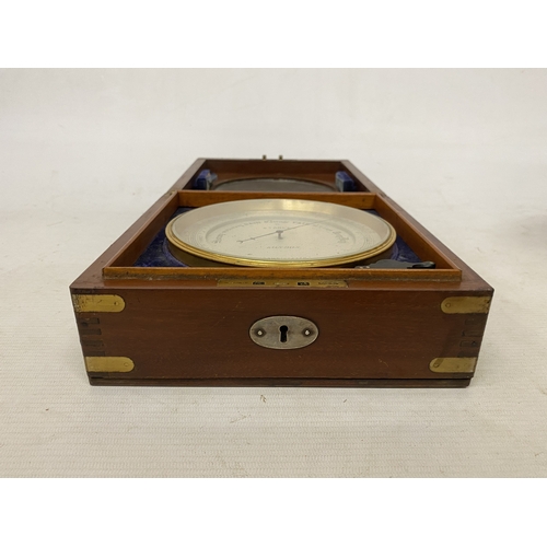 16 - AN ANEROID DESK BAROMETER MANUFACTURED BY STANLEY OF LONDON WITH A CIRCULAR GLAZED WINDOW ON A HINGE... 