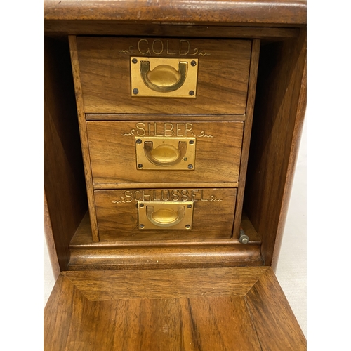 3 - A VINTAGE THREE DOOR CAMPAIGN JEWELLERY CABINET WITH BRASS RECESSED HANDLES, COMPLETE WITH KEY AND D... 