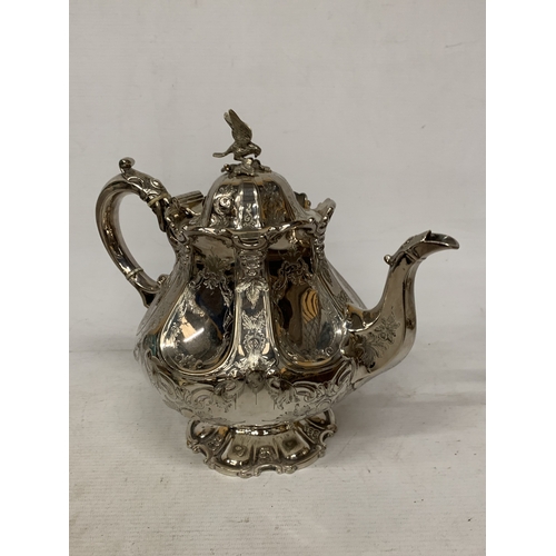 37 - A ROCOCO STYLE SILVER PLATE TEAPOT WITH HIGH RELIEF DECORATION WITH AN EAGLE FINIAL