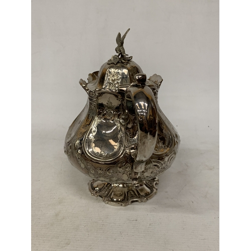 37 - A ROCOCO STYLE SILVER PLATE TEAPOT WITH HIGH RELIEF DECORATION WITH AN EAGLE FINIAL