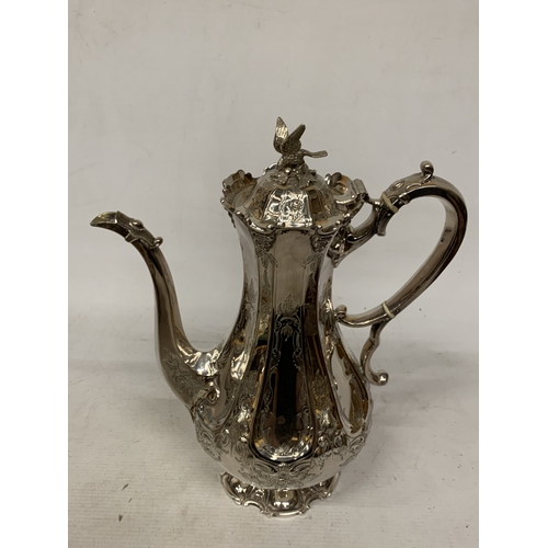 40 - A ROCOCO STYLE SILVER PLATE COFFEEPOT WITH HIGH RELIEF DECORATION WITH AN EAGLE FINIAL