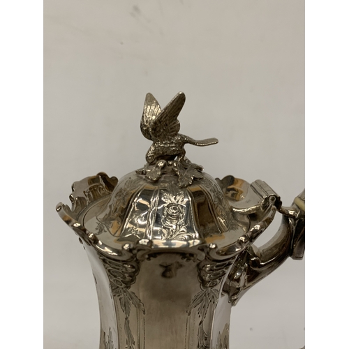 40 - A ROCOCO STYLE SILVER PLATE COFFEEPOT WITH HIGH RELIEF DECORATION WITH AN EAGLE FINIAL