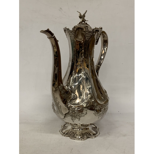 40 - A ROCOCO STYLE SILVER PLATE COFFEEPOT WITH HIGH RELIEF DECORATION WITH AN EAGLE FINIAL