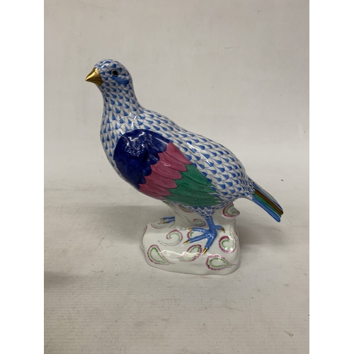46 - A HEREND PORCELAIN PARTRIDGE FIGURE MODEL NUMBER 5071 WITH THE BRAND'S SIGNATURE BLUE FISHNET PATTER... 