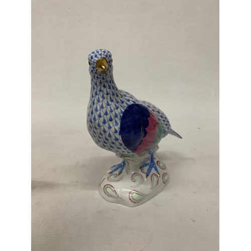 46 - A HEREND PORCELAIN PARTRIDGE FIGURE MODEL NUMBER 5071 WITH THE BRAND'S SIGNATURE BLUE FISHNET PATTER... 