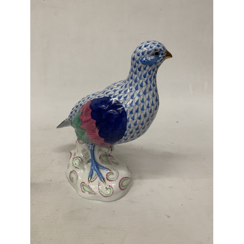 46 - A HEREND PORCELAIN PARTRIDGE FIGURE MODEL NUMBER 5071 WITH THE BRAND'S SIGNATURE BLUE FISHNET PATTER... 