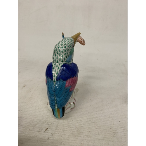 46 - A HEREND PORCELAIN PARTRIDGE FIGURE MODEL NUMBER 5071 WITH THE BRAND'S SIGNATURE BLUE FISHNET PATTER... 