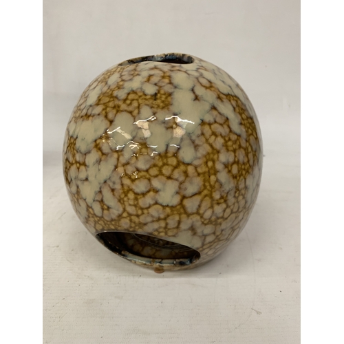 53 - A CERAMIC BROWN AND BEIGE DRIP GLAZE SKULL CANDLE HOLDER