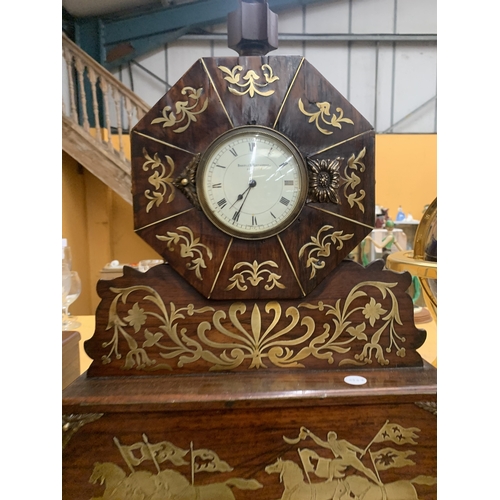 48A - A REGENCY STYLE MANTEL CLOCK WITH INTRICATE BRASS INLAY DEPICTING HORSES AND RIDERS HOUSED IN AN OCT... 