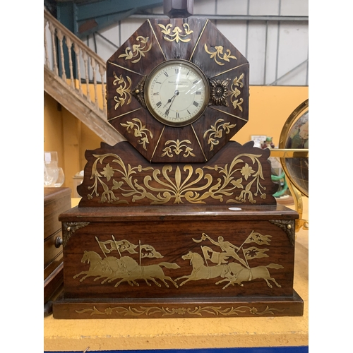 48A - A REGENCY STYLE MANTEL CLOCK WITH INTRICATE BRASS INLAY DEPICTING HORSES AND RIDERS HOUSED IN AN OCT... 