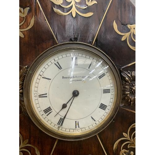 48A - A REGENCY STYLE MANTEL CLOCK WITH INTRICATE BRASS INLAY DEPICTING HORSES AND RIDERS HOUSED IN AN OCT... 