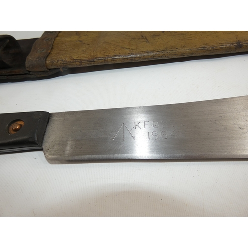 312 - A MILITARY MACHETTE AND SCABBARD, THE 37CM BLADE DATED 1964