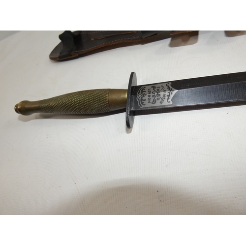 313 - A FAIRBAIRN SYKES FIGHTING KNIFE AND SCABBARD, 17CM BLADE, LENGTH 33CM