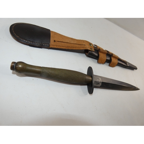 313 - A FAIRBAIRN SYKES FIGHTING KNIFE AND SCABBARD, 17CM BLADE, LENGTH 33CM