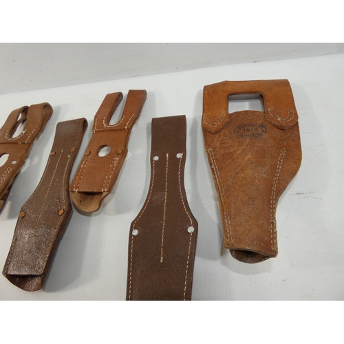 333 - A COLLECTION OF FIVE LEATHER BAYONET FROGS