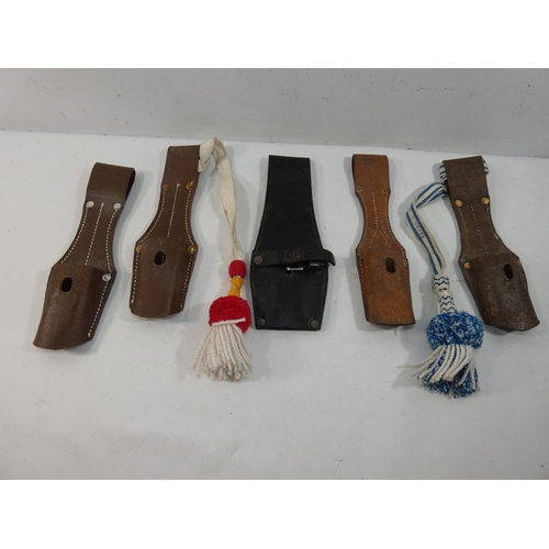 334 - A COLLECTION OF FIVE LEATHER BAYONET FROGS