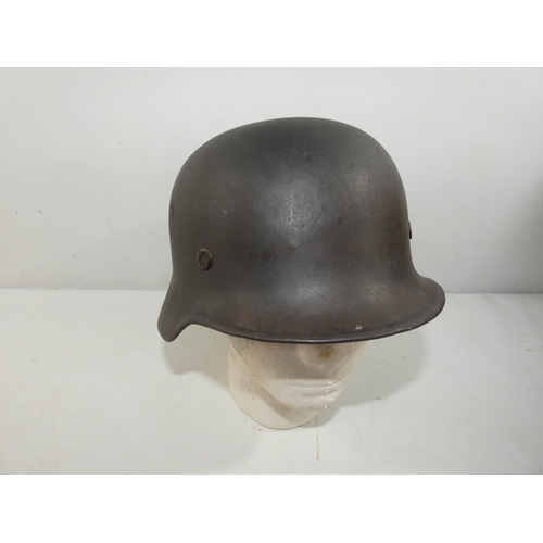 342 - A GERMAN M40 STEEL HELMET AND LINER