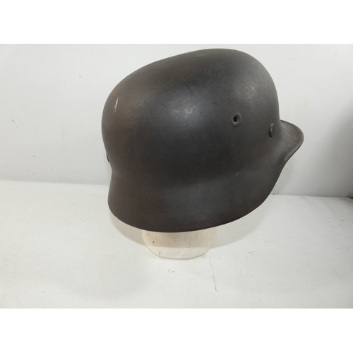 342 - A GERMAN M40 STEEL HELMET AND LINER