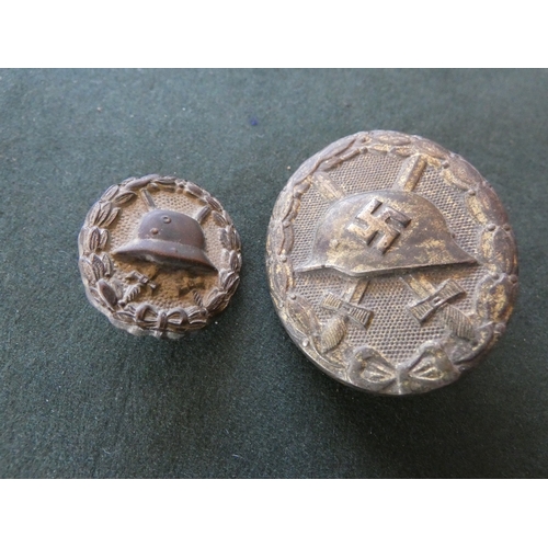354 - A WORLD WAR II NAZI GERMANY GILT METAL WOUND BADGE AND A SMALLER IMPERIAL GERMAN VERSION (2)