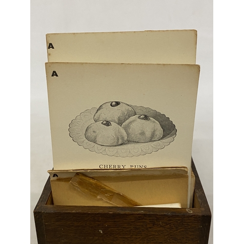 11 - A CIRCA 1920'S SET OF COMMERCIAL BAKERY RECIPE CARDS IN AN OAK CASE