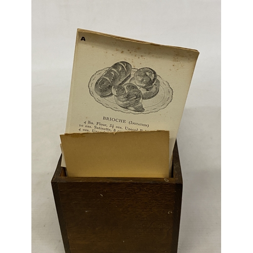 11 - A CIRCA 1920'S SET OF COMMERCIAL BAKERY RECIPE CARDS IN AN OAK CASE