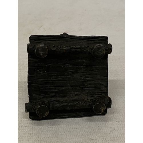 13 - A BRONZE COLD PAINTED FIGURE OF A SQUATTING MAN, HEIGHT 11 CM