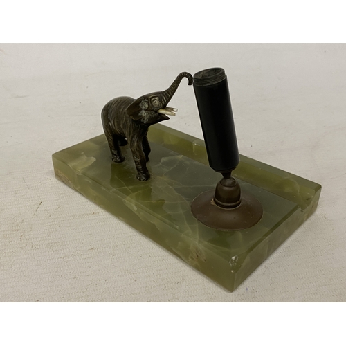 26 - AN ART DECO DESK TOP FOUNTAIN PEN HOLDER WITH A CAST METAL ELEPHANT FIGURE ON A GREEN ONYX BASE
