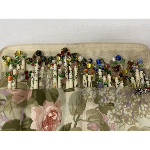 32 - A COLLECTION OF APPROX 54 BONE LACE MAKING BOBBINS WITH DECORATION, CHARMS AND SPANGLES