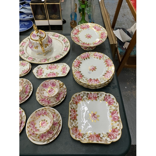 54 - AN ANTIQUE 'SWANSEA ROSE' BY GROSVENOR, CHINA TEASET TO INCLUDE A CAKE STAND, TRIOS, LIDDED CABBAGE ... 