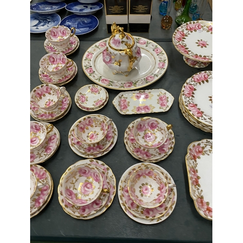 54 - AN ANTIQUE 'SWANSEA ROSE' BY GROSVENOR, CHINA TEASET TO INCLUDE A CAKE STAND, TRIOS, LIDDED CABBAGE ... 