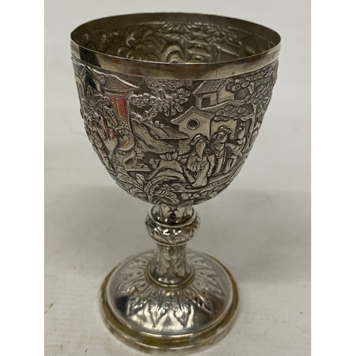 1 - A TESTED TO 800 SILVER CHINESE EXPORT GOBLET WITH REPOUSSE DECORATION OF FIGURES IN A LANDSCAPE WITH... 
