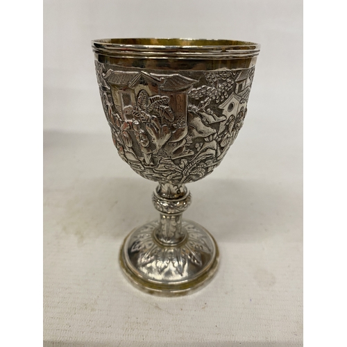 1 - A TESTED TO 800 SILVER CHINESE EXPORT GOBLET WITH REPOUSSE DECORATION OF FIGURES IN A LANDSCAPE WITH... 
