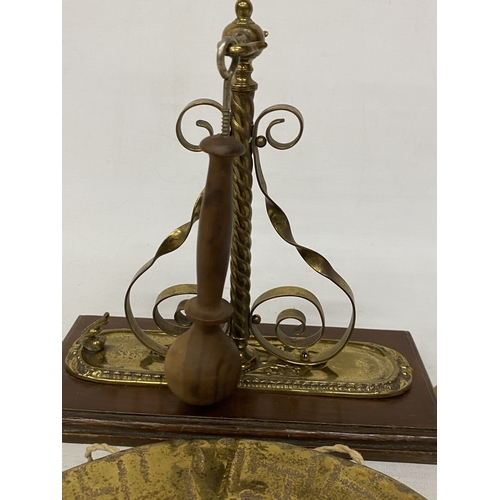37 - A VINTAGE BURMESE BRASS WALL HANGING GONG AND STRIKER